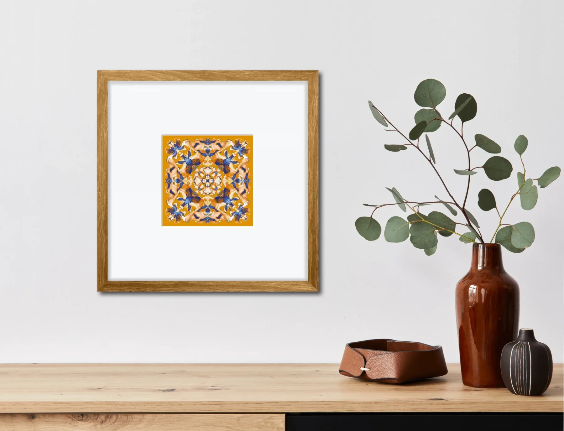 colorful mandala drawing print in frame with home decor elements